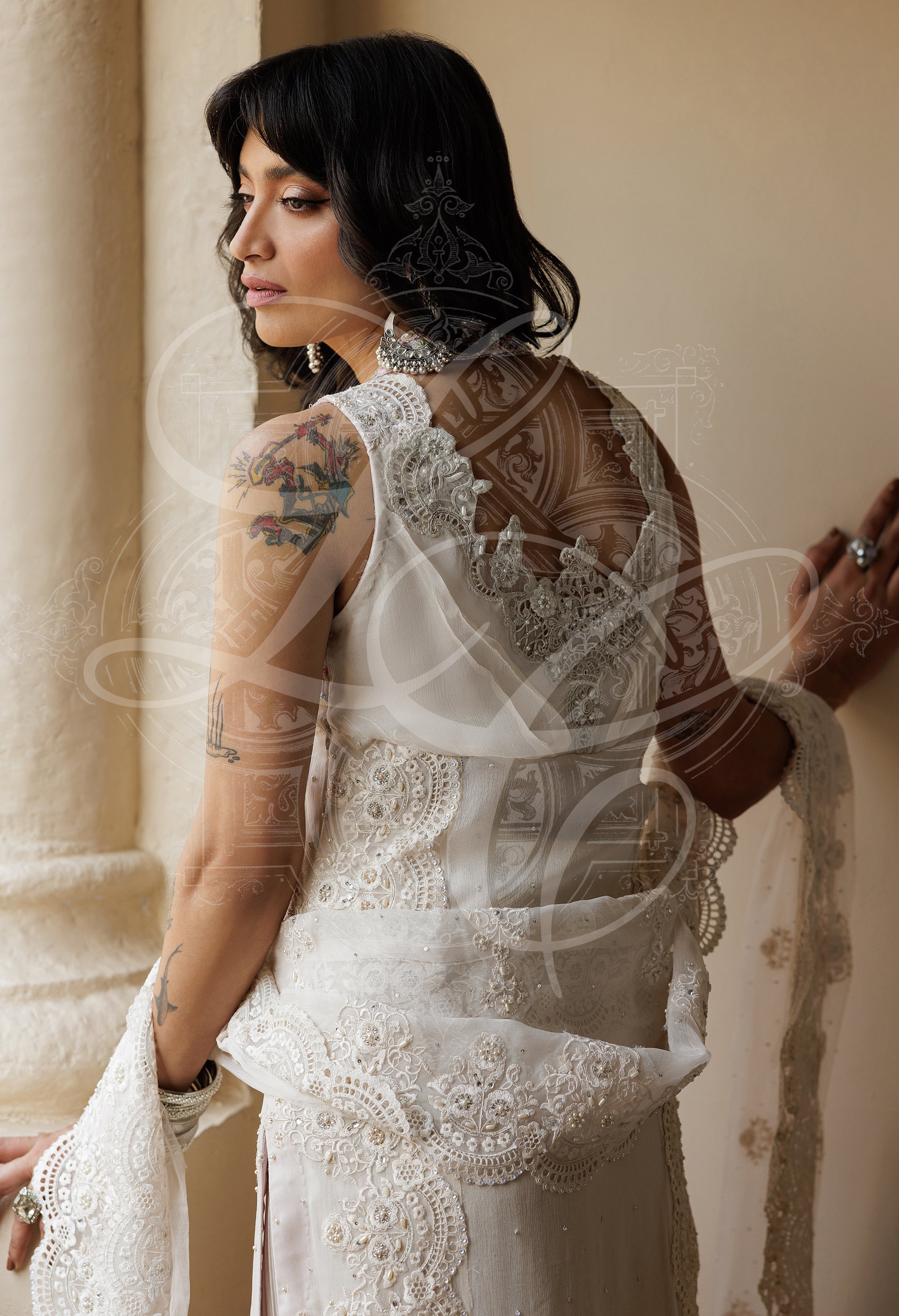 Parvaneh - Long cutwork kameez with Striped gharara and organza ruffle