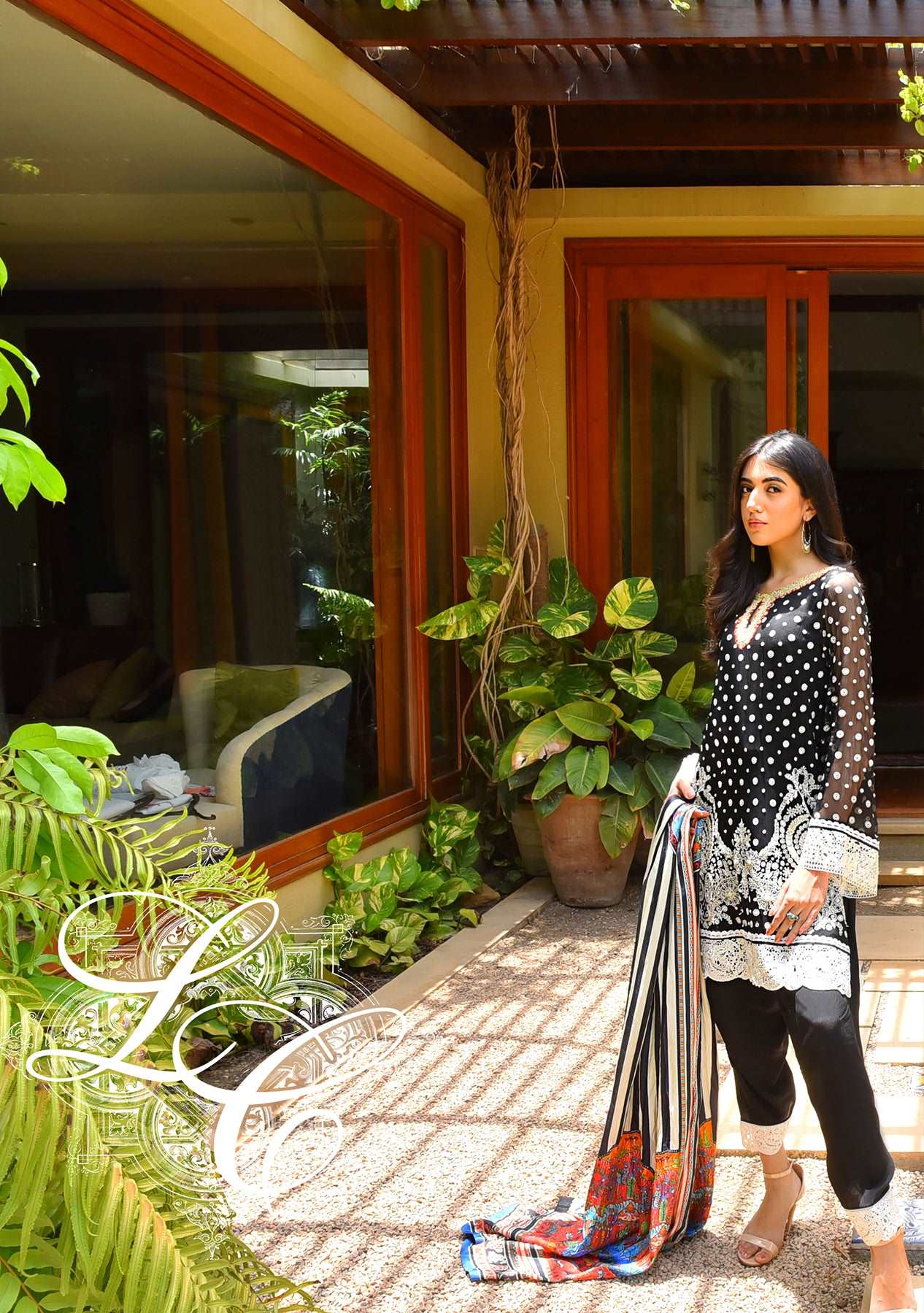 Black and white short kurta with a shalwar