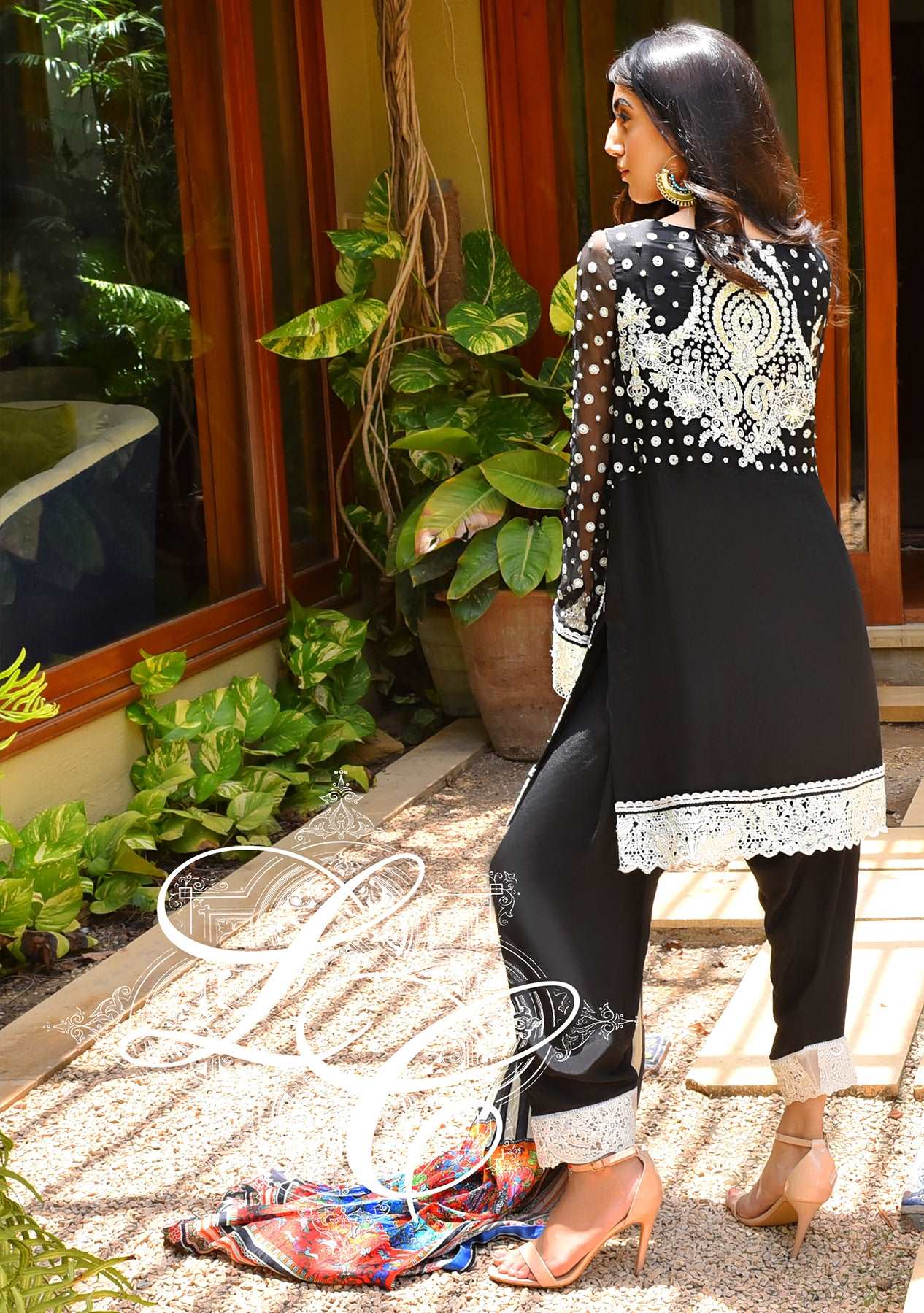 Black and white short kurta with a shalwar