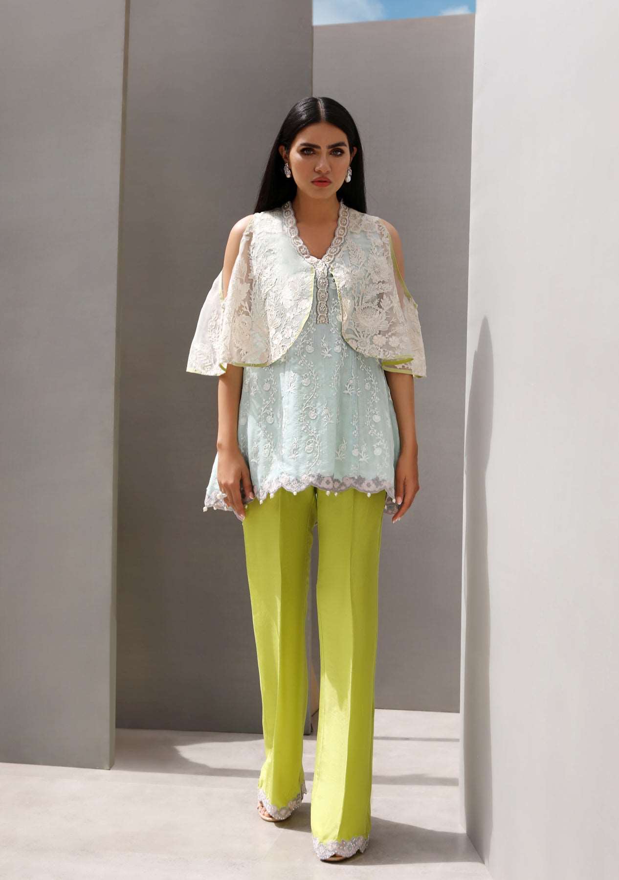 Cape with peplum top and pearl detailed pants