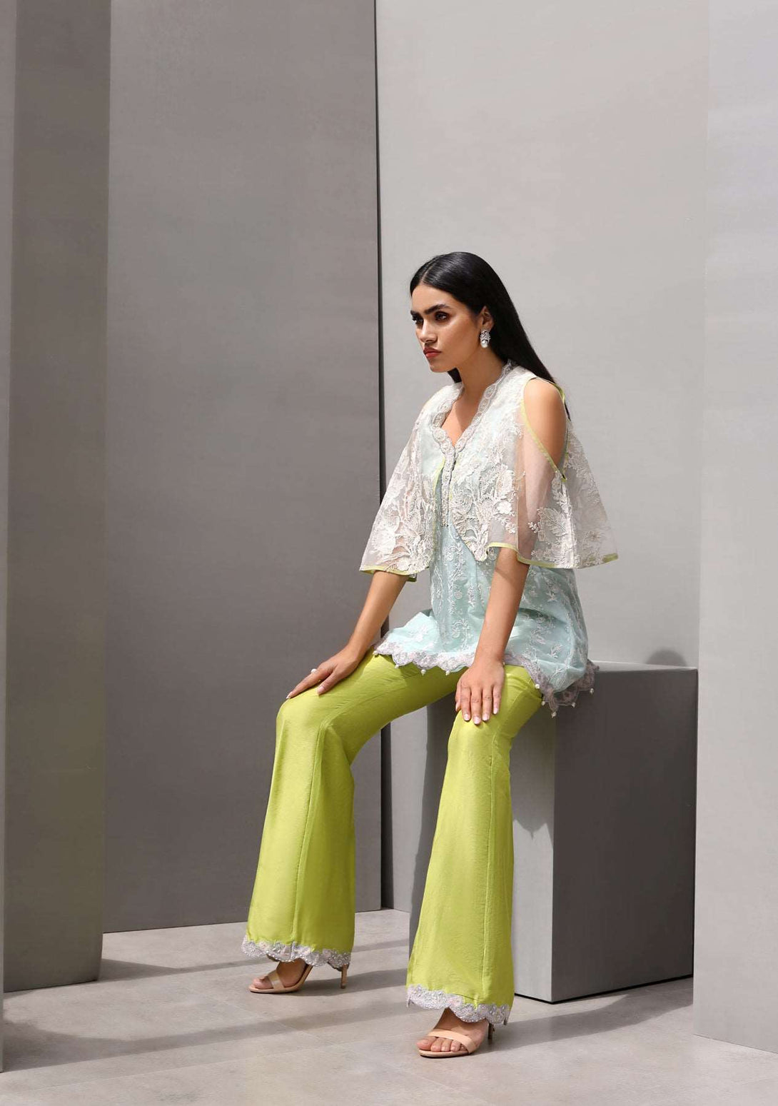 Cape with peplum top and pearl detailed pants