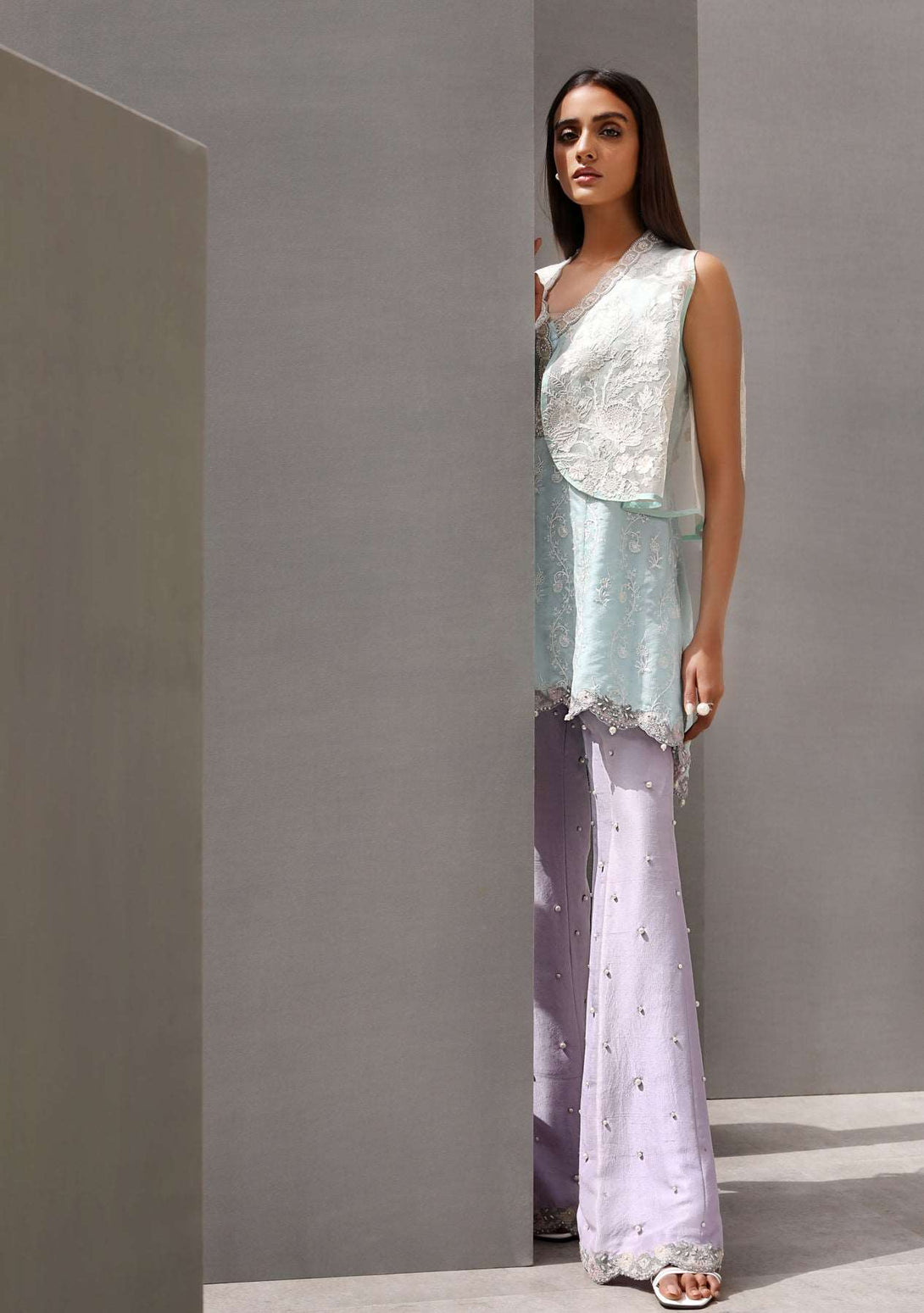 Cape with peplum top and pearl detailed pants