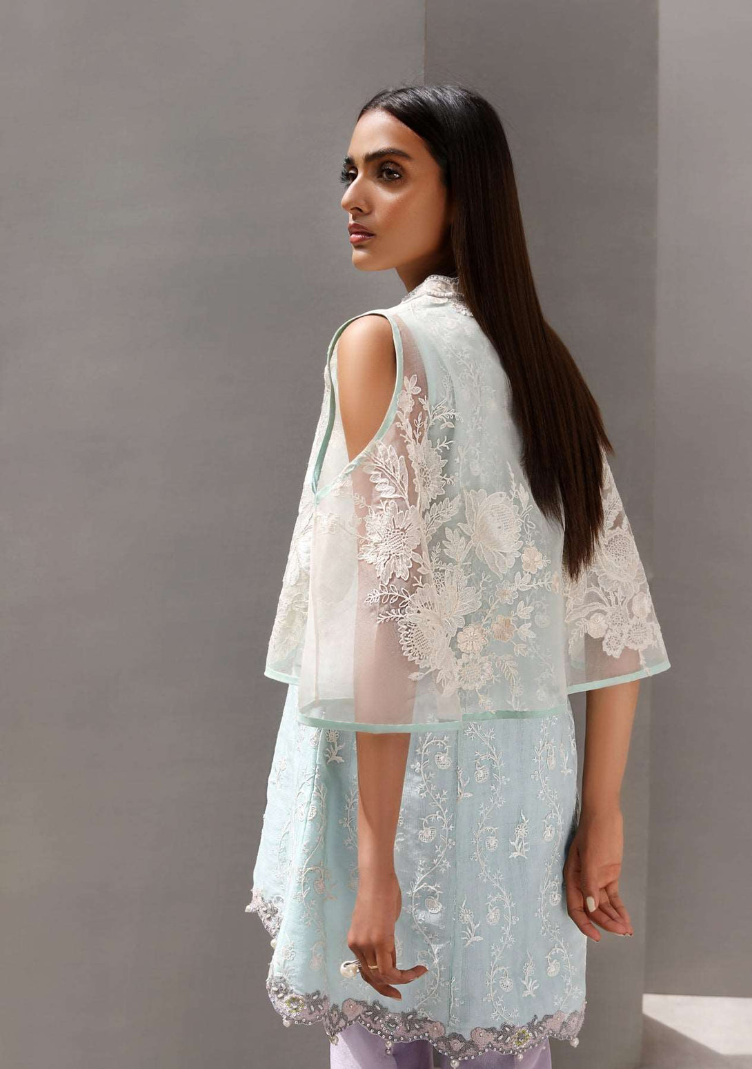 Cape with peplum top and pearl detailed pants