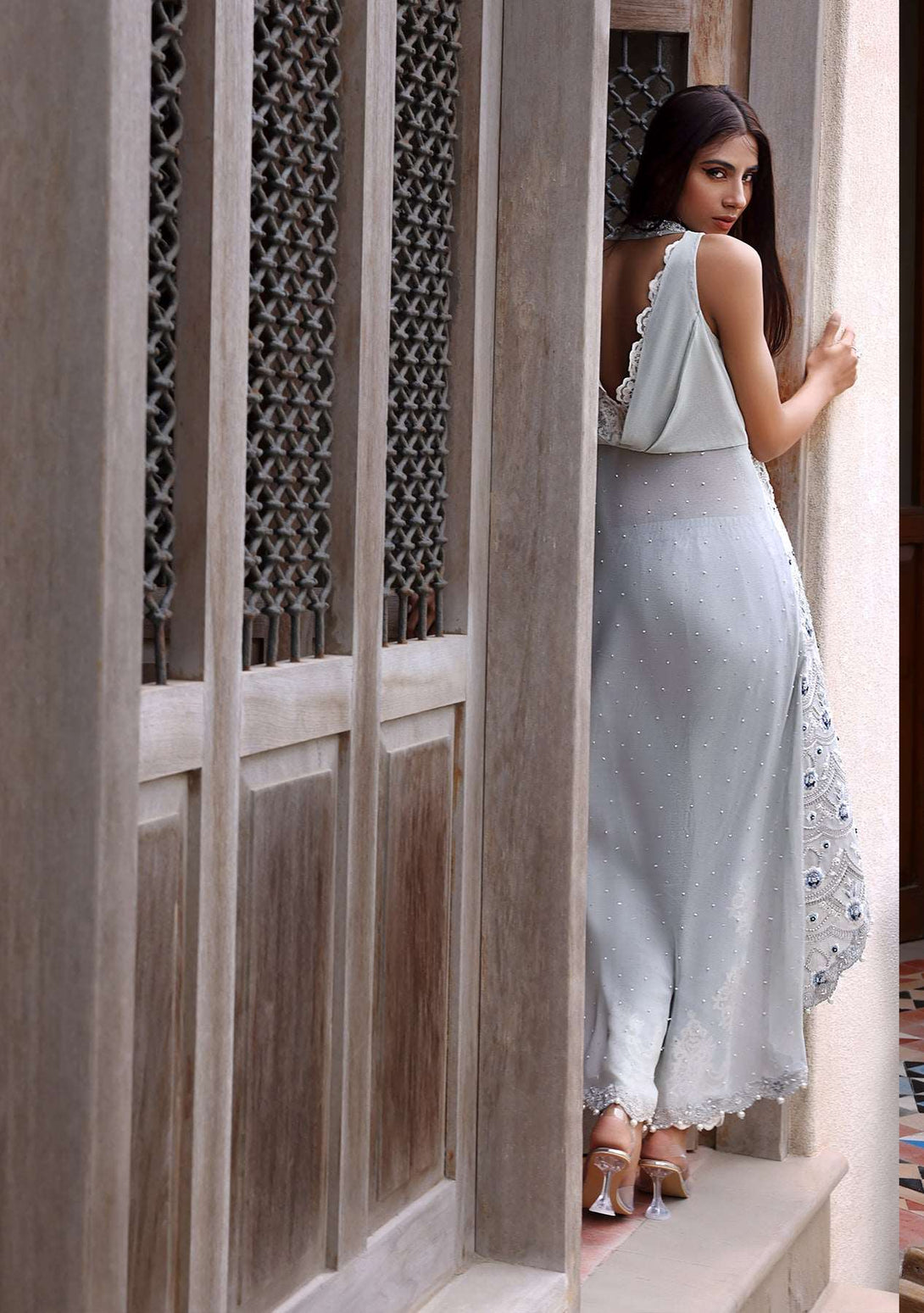 Grey halter long tunic paired with embellished pants